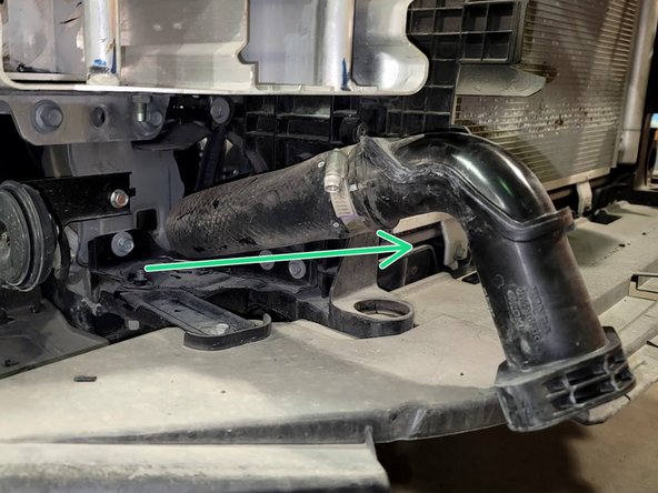 Pull rubber hose off turbo and then the intercooler inlet assembly off car as shown