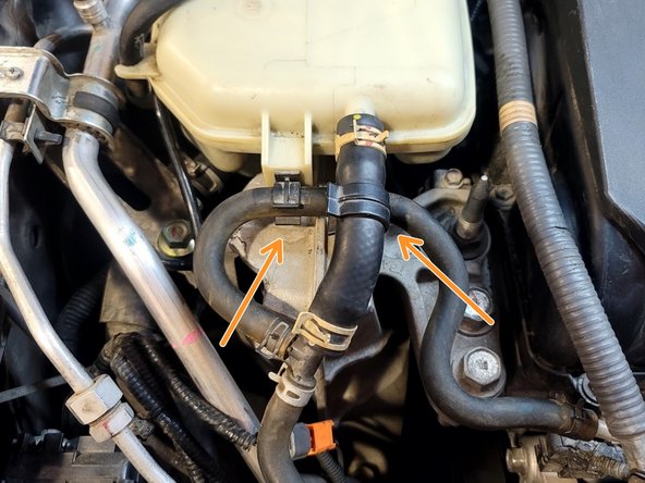 Pop hoses free from clip