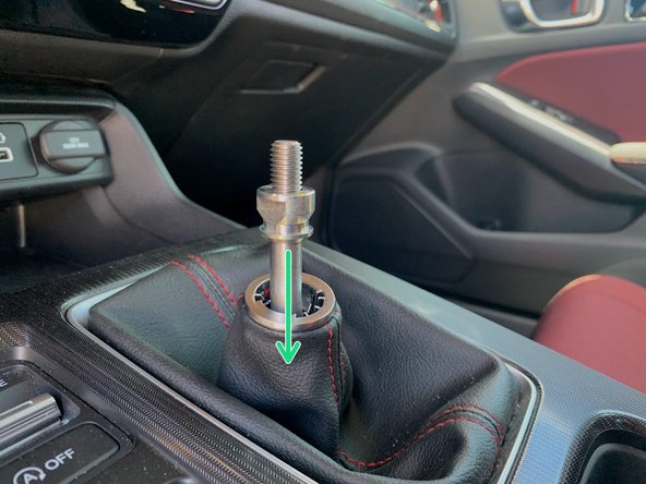 Thread the OEM locking nut down until it bottoms out