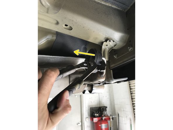 Pull the dual rod rubber hangers off the exhaust hanger rods; the rubber hangers will stay on the vehicle