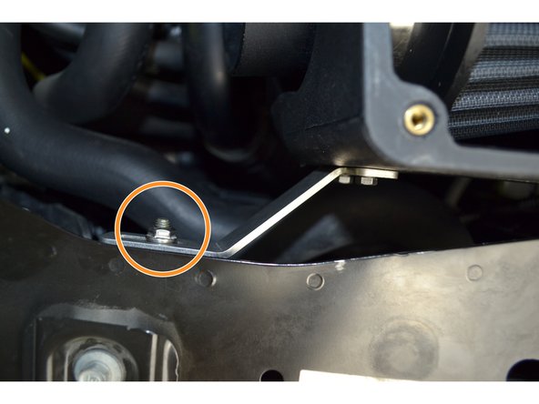 Tighten the M6x1.0 flange nut on the rubber isolator using a 10mm socket and ratchet to 24-36 in-lbs