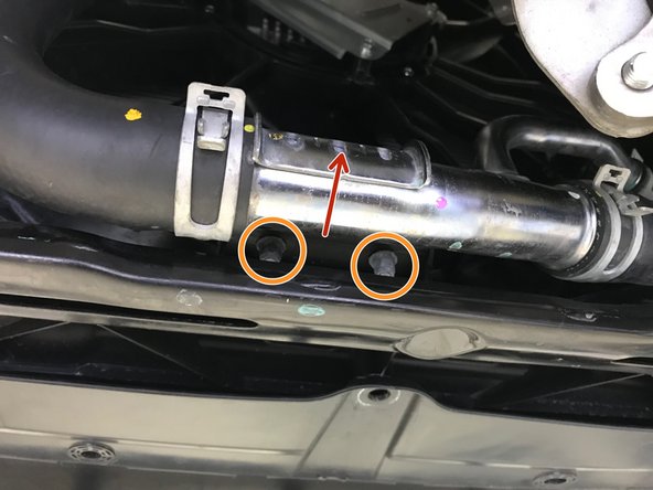 Move the radiator hose back into the correct position so the bolt holes and bracket holes align