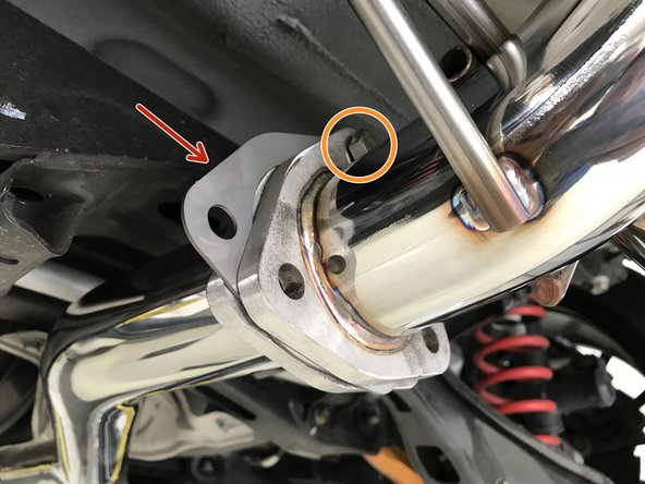 Install the provided tri-bolt gasket between the muffler section and the rear mid-pipe section as shown