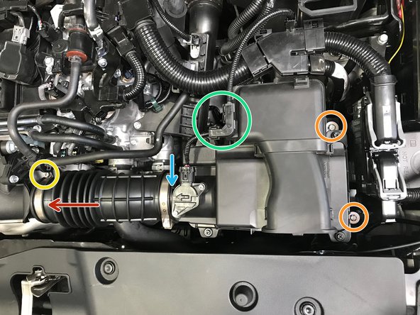 Lower the airbox assembly into the engine bay