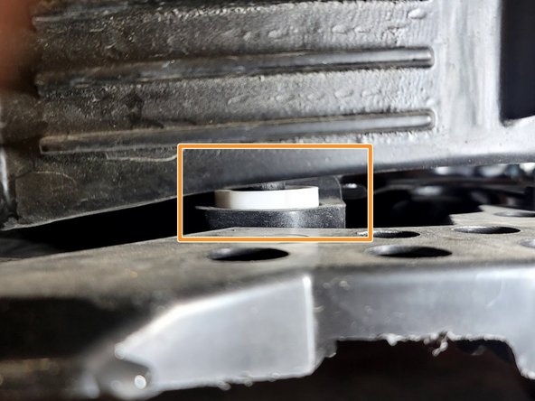 Place Q=1 provided polyurethane bushing on the bottom peg of each end tank. Don't push bushing all the way on the peg