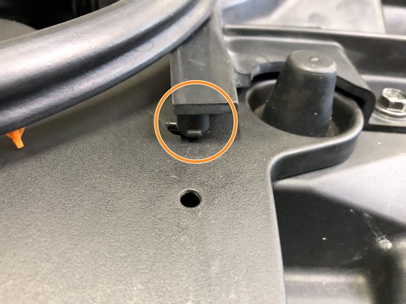 Free the large rubber tab (orange circle) from the corner of the OEM intake duct by pulling upwards