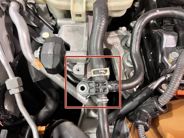 Using a 10mm socket, 3/8&quot; ratchet, and extension remove the (2) 10mm bolts securing the coolant hose bracket. Set aside for reinstalling later