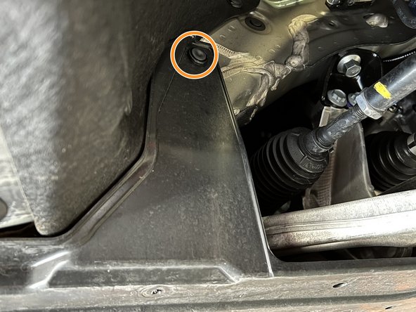 Use a large flat head screw driver or prying tool to remove the push-clip from each front wheel well