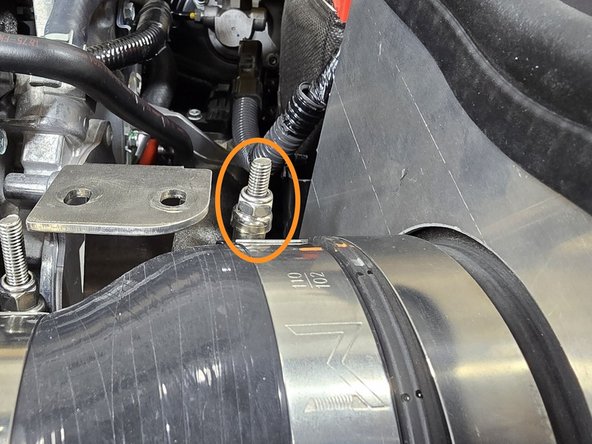 With the intake position finalized, move the filter bracket back to the side and use a 10mm socket to tighten down the 102-110mm clamp