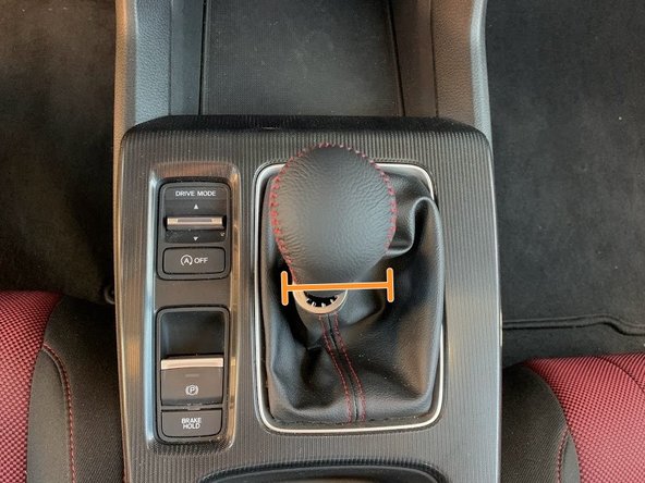 Hand thread the 27WON shift knob onto the shifter rod until it bottoms out on the OEM locking nut and washer