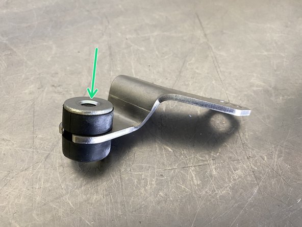 Press in the rubber isolator in the same way it was removed