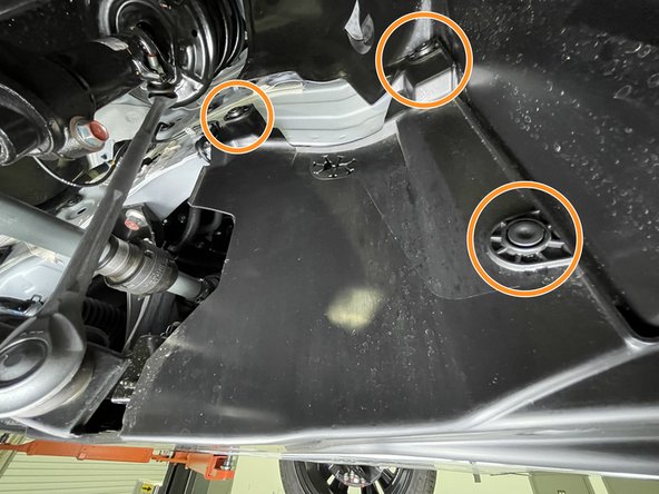 Use a large flat head screw driver or prying tool to remove the four (4) push-clips from each front wheel well