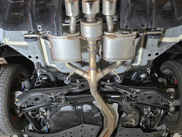 There is one mounting bracket on each side of the exhaust