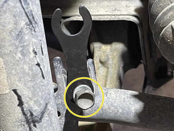 Using the OEM 12mm bolts, install a provided brake line bracket onto the strut as shown. Torque down to 10-14 ft-lbs