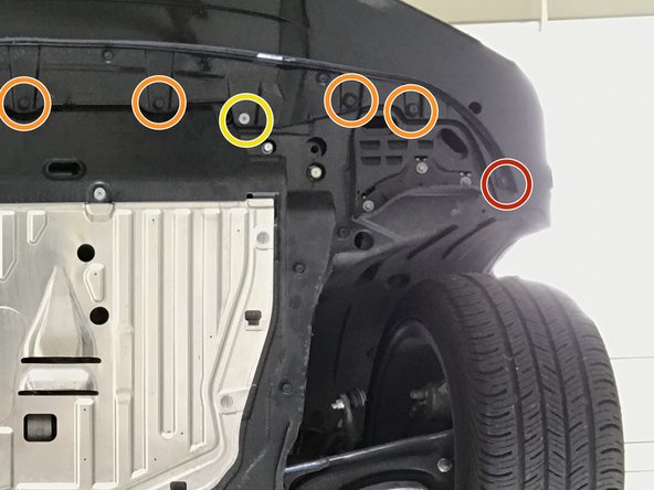 Use a flathead screwdriver to remove the seven (7) plastic push-clips