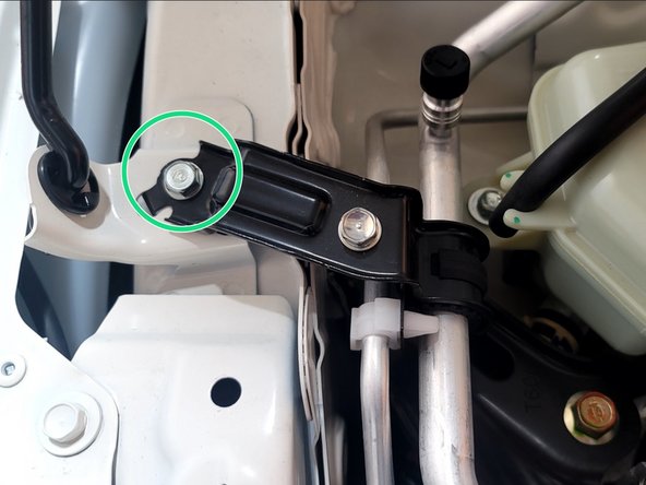 Reinstall the A/C line bracket with the 10mm bolt. Torque to snug