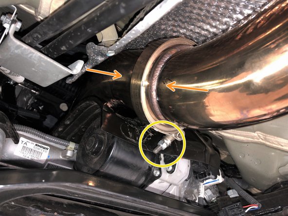 Install the forward mid-section onto the vehicle.  Mount the rubber hanger on the chassis hanger rod.  Verify the rod bead is fully through the rubber hanger