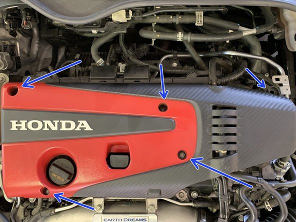 Use a10mm socket to remove the 5 bolts holding the engine cover