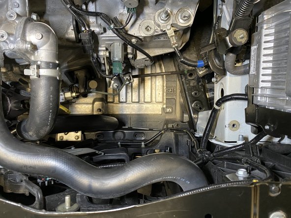 Remove the OEM cold pipe lower section from the vehicle through the engine bay