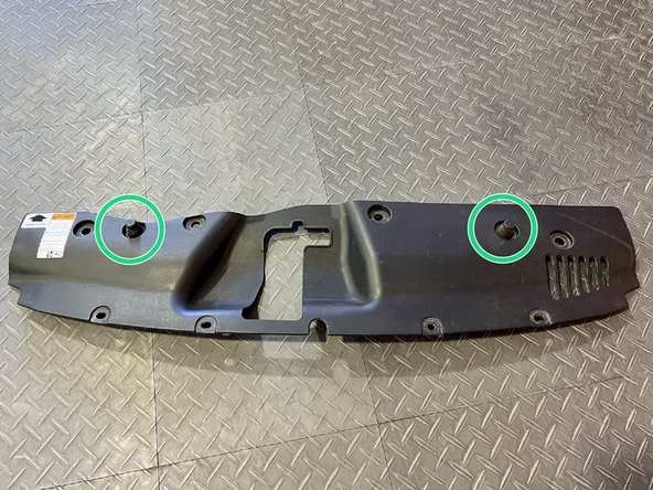 Grab the OEM shroud you removed in Step 4 and locate the two rubber stops circled in green