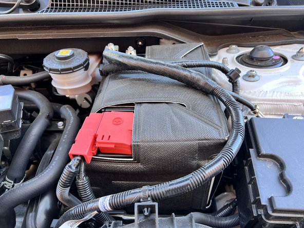 Use 10mm deep socket and ratchet to remove the 2x 10mm nuts on  the  j-hooks