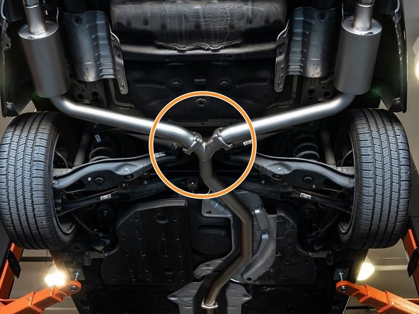 Using the same location as before, support the back of your 27WON exhaust with a friend or jack