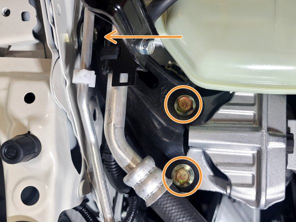 Use a 14mm socket and ratchet to remove the (3) 14mm bolts securing the side engine mount auxiliary bracket