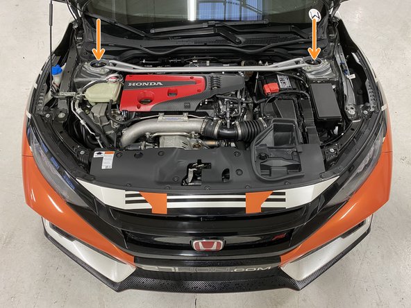 Place each end of the strut bar down on the strut tops over the studs