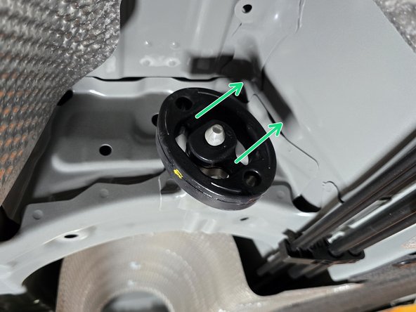 Use tongue &amp; groove pliers to press the metal hangers out of the rubber hanger. Remove the hangers of the exhaust from the rubber supports as shown