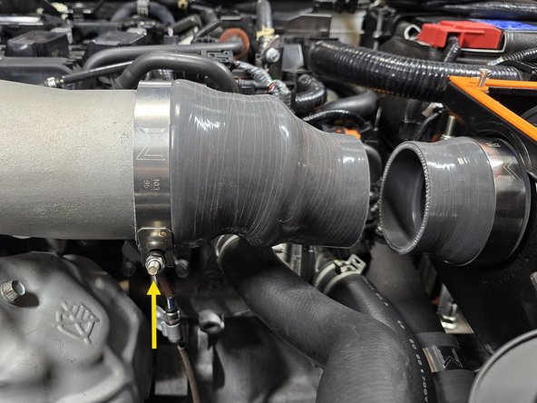 Orient the clamp so it will not hit the hood as shown