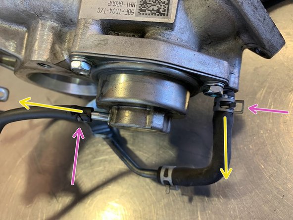 Loosen the clamps holding the vacuum hoses to turbo housing