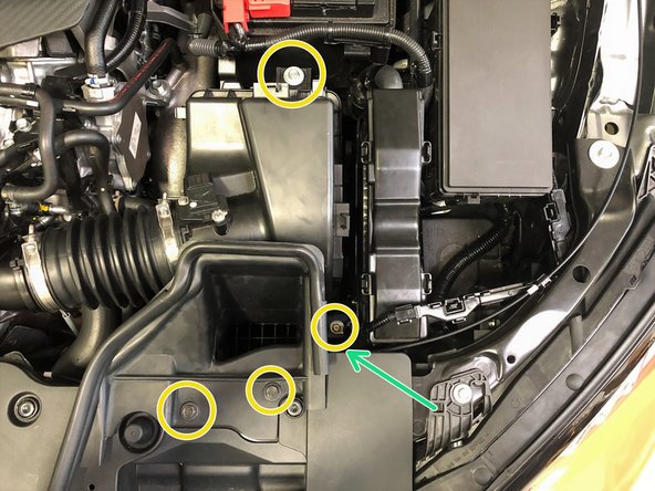 Secure the hoses using needle nose pliers to move the spring clamps into position