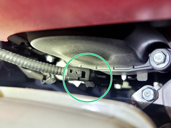 Remove bolt securing wiring loom with a 10mm socket and ratchet