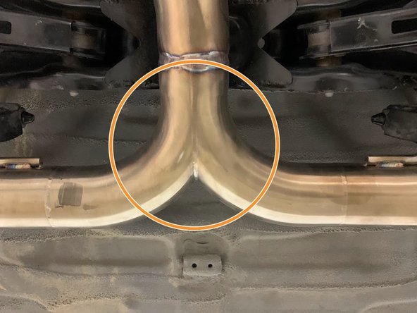 Using the same location as before, support the back of your 27WON exhaust with a friend or jack