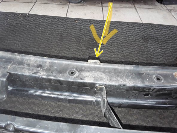 EU cars have an extra black crash bar shown by the red arrow