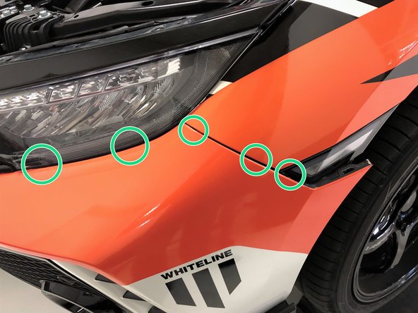 Then lift the top of the bumper upwards and inwards to place it on top of the upper bumper support