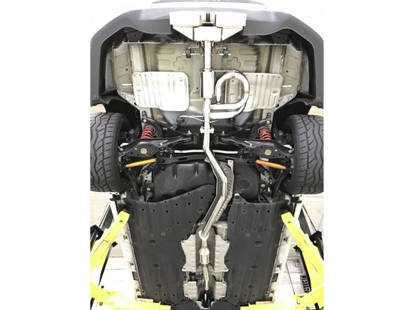 Remove the protective bubble wrap and cardboard from the 27WON exhaust system as shown