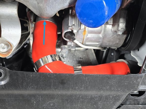 Install the two supplied 60-68mm clamps near the center of the boost tube as shown