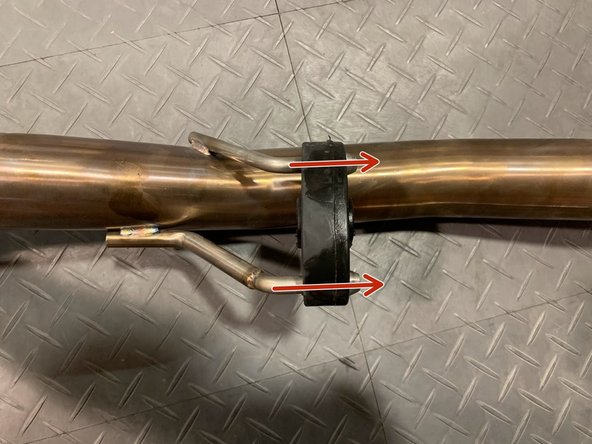 Reinstall the rubber support on the 27WON forward mid-pipe hangers