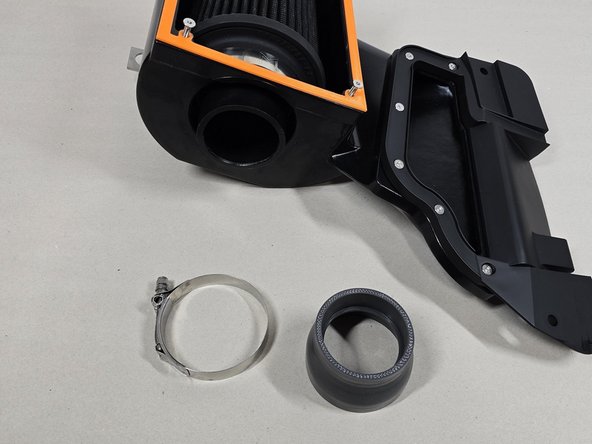 Using a 10mm socket remove the 83-91 T-bolt clamp on the airbox