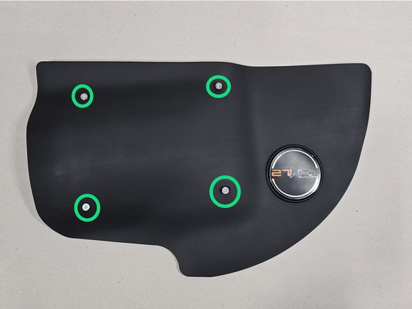 While holding the gasket in place, push the QTY(4) countersink screws through the top of the shroud and the gasket as shown