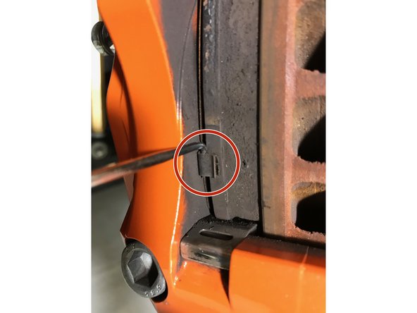 Using a 90deg pick tool, hook the pick on the backer plate of the brake pad then remove brake pad