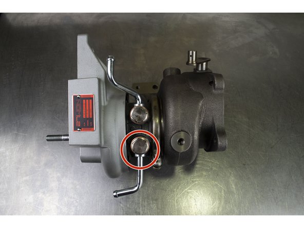 Install the lower coolant pipe on the turbo as shown.  Torque to 32-36 ft-lbs