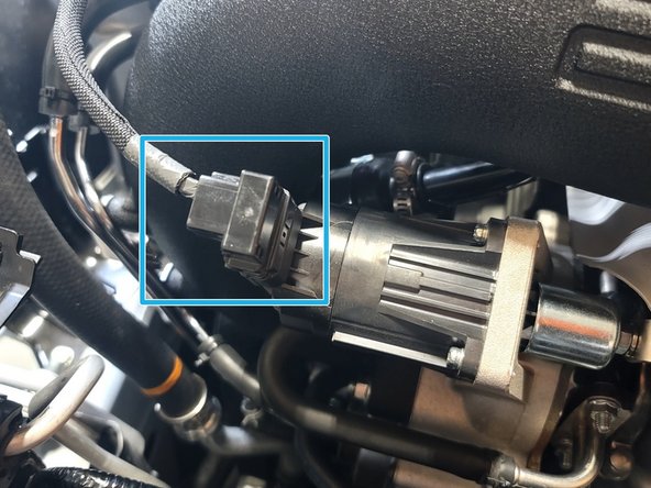 Wiggle and pull bracket to line up holes to bolts