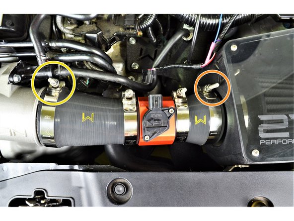 Use a 10mm wrench or socket and ratchet to loosen the clamp on the turbo inlet pipe