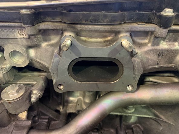 Install the provided turbo manifold gasket as shown