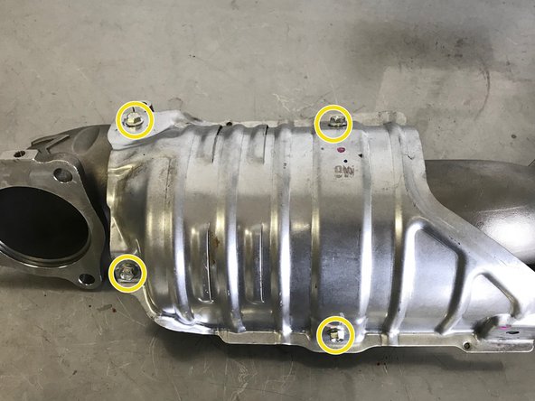 Use a 10mm socket and torque wrench to install the provided four (4) 10mm flange bolts and heat shield.  Torque to 12-15 ft-lbs