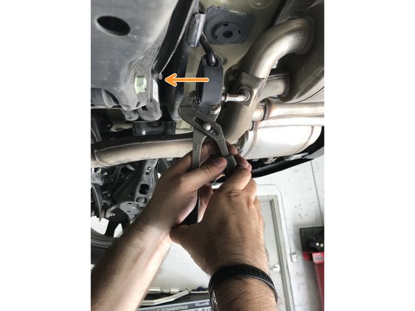 Use tongue &amp; groove pliers to press the rod out of the rubber hanger