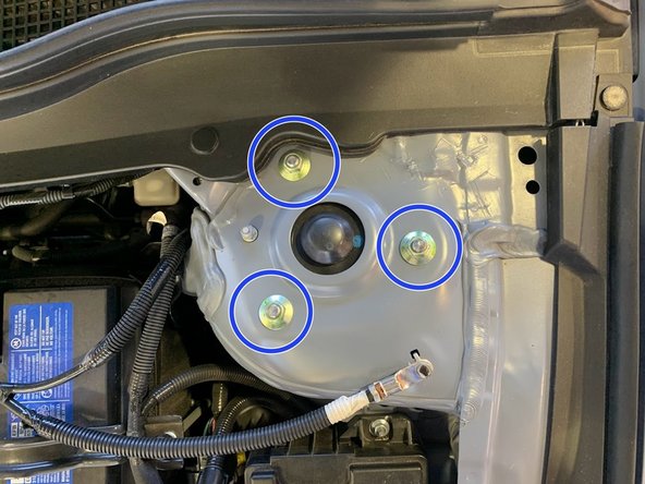 Remove three (3) flange nuts with a 14mm deep socket and ratchet wrench from the passenger side