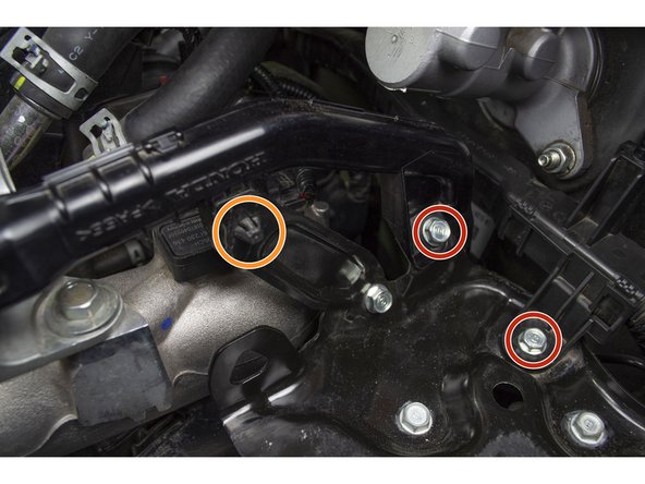 Remove the 2 bolts with a 10 mm deep socket and ratchet and set them aside.